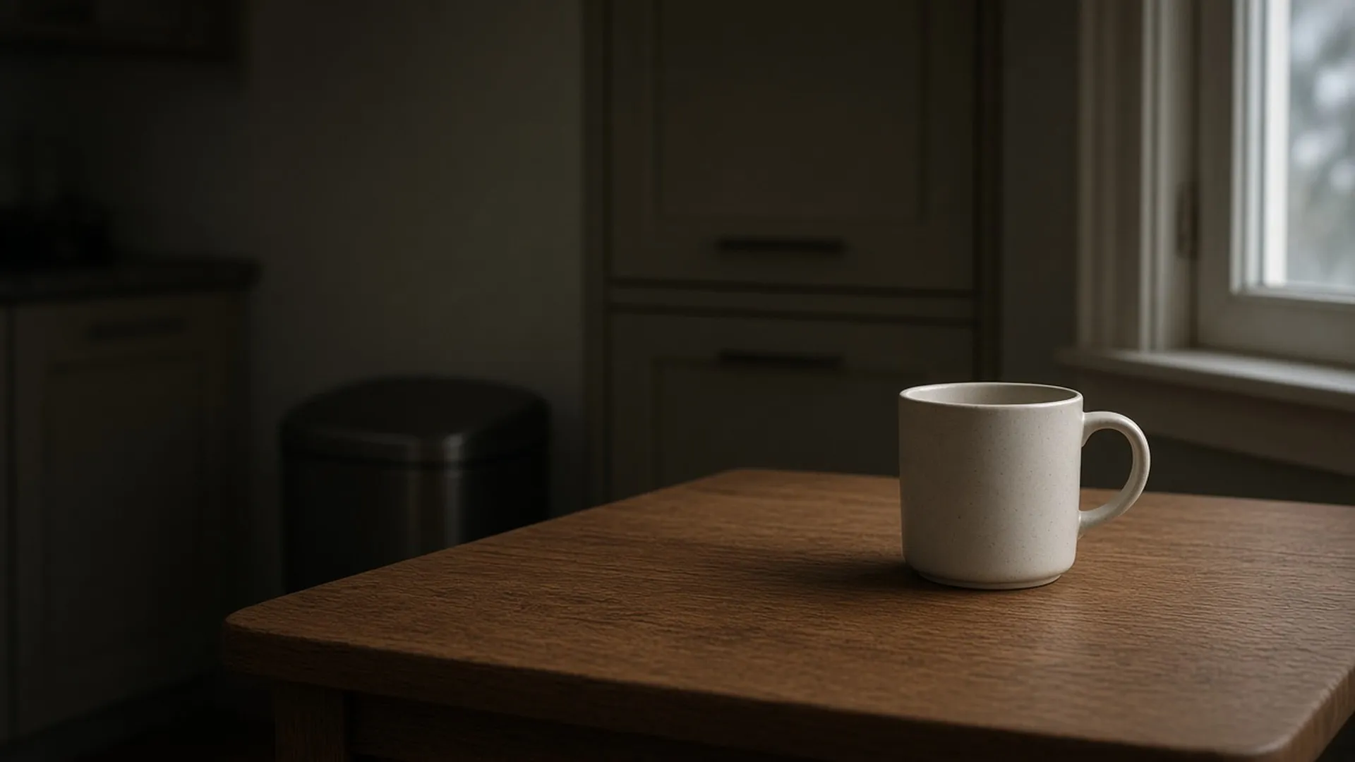 A quiet kitchen table by a window